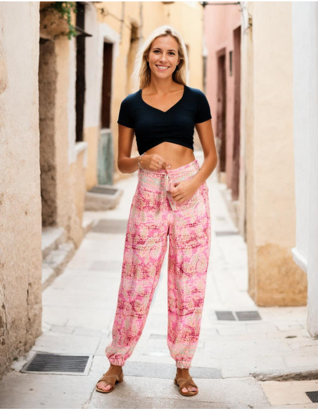 Pantalon en soie imprimé dans les tons roses